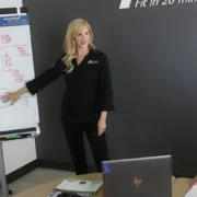 Two women at Fit20 reviewing a chart.